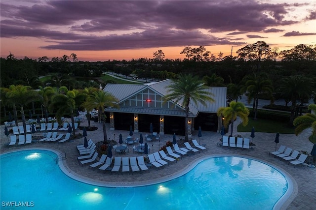 7773 Jacaranda Ln, Naples, FL 34114 - community pool with a patio area