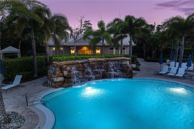 7773 Jacaranda Ln, Naples, FL 34114 - pool at dusk with a patio and an outdoor pool