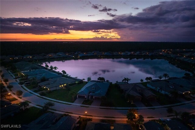 7773 Jacaranda Ln, Naples, FL 34114 - aerial perspective of suburban area with a nearby body of water