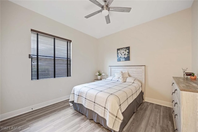 3820 Ruby Way, Naples, FL 34114 - bedroom with light wood finished floors and a ceiling fan