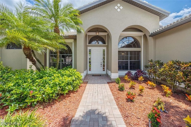 3820 Ruby Way, Naples, FL 34114 - view of exterior entry with stucco siding
