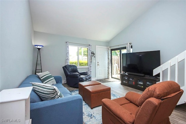 8849 Somerset Blvd, Fort Myers, FL 33919 - living area featuring light wood-type flooring and high vaulted ceiling