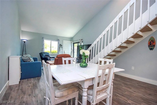 8849 Somerset Blvd, Fort Myers, FL 33919 - dining room with wood finished floors, vaulted ceiling, and stairway