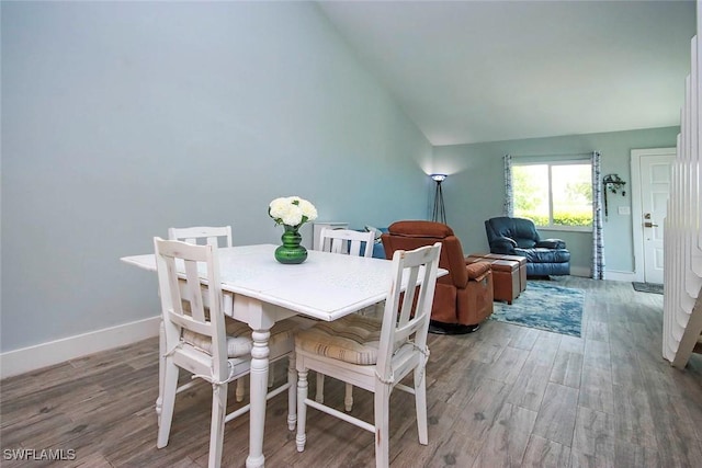 8849 Somerset Blvd, Fort Myers, FL 33919 - dining room featuring lofted ceiling and wood finished floors