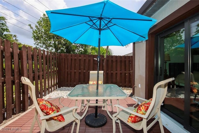 8849 Somerset Blvd, Fort Myers, FL 33919 - wooden terrace with outdoor dining space