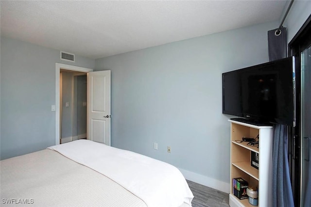 8849 Somerset Blvd, Fort Myers, FL 33919 - bedroom with wood finished floors and baseboards