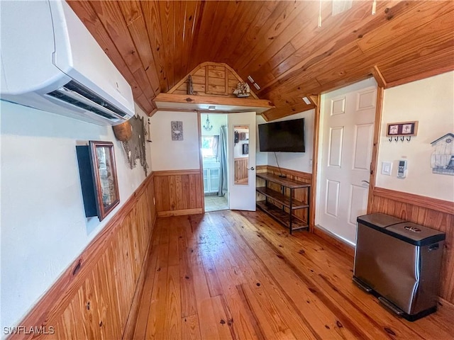 2595 Pine St, Matlacha, FL 33993 - living room with wooden ceiling, wainscoting, wooden walls, a wall mounted AC, and vaulted ceiling