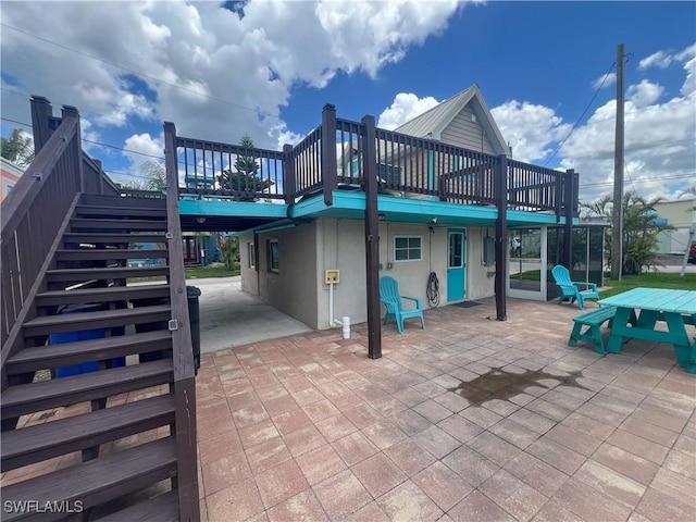 2595 Pine St, Matlacha, FL 33993 - view of patio featuring stairway and a wooden deck