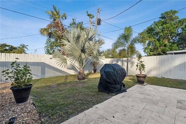 1423 Charles Rd, Fort Myers, FL 33919 - fenced backyard featuring a patio