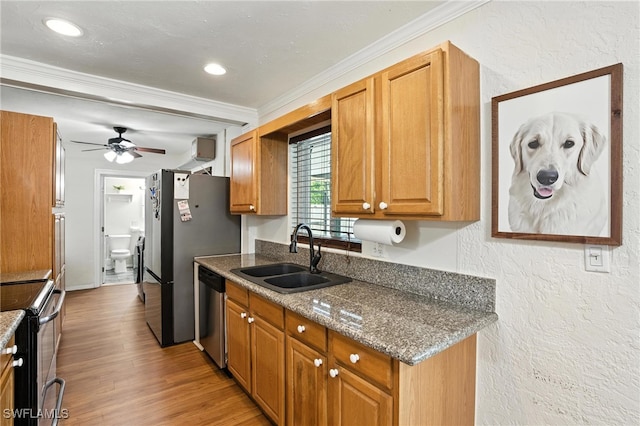 1423 Charles Rd, Fort Myers, FL 33919 - kitchen with appliances with stainless steel finishes, ornamental molding, a ceiling fan, light wood finished floors, and a textured wall