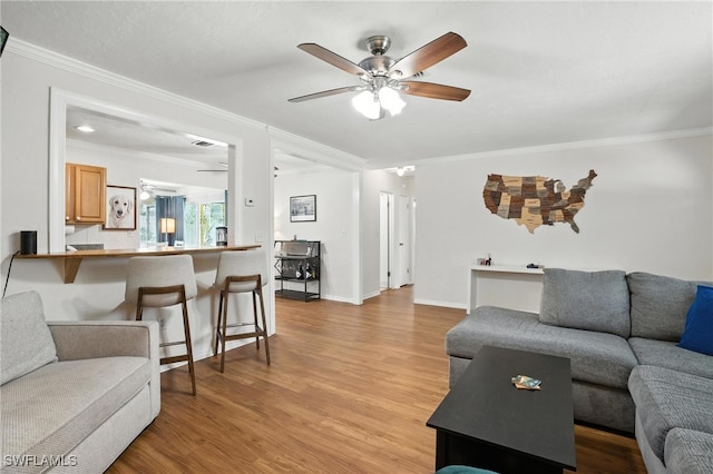 1423 Charles Rd, Fort Myers, FL 33919 - living area with crown molding, a ceiling fan, and light wood finished floors