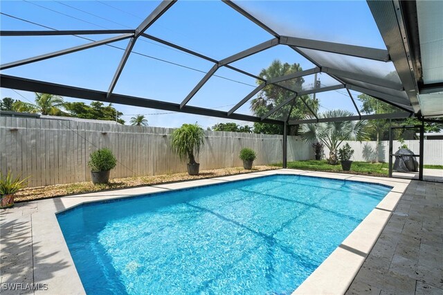 1423 Charles Rd, Fort Myers, FL 33919 - view of pool with a fenced backyard, a patio, and glass enclosure
