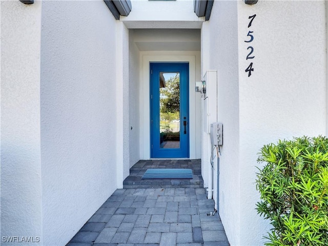 7524 Carnegie Way, Naples, FL 34119 - entrance to property with stucco siding