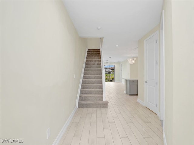 7524 Carnegie Way, Naples, FL 34119 - stairs with wood finished floors and recessed lighting