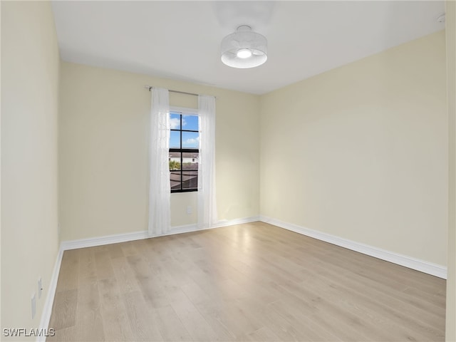 7524 Carnegie Way, Naples, FL 34119 - empty room with light wood finished floors and baseboards