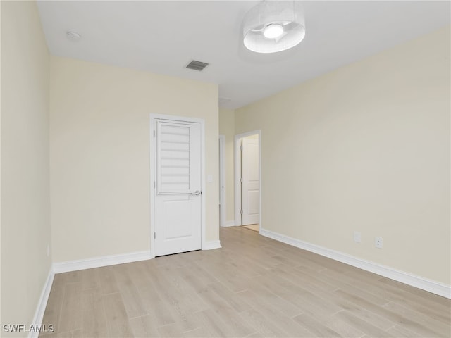 7524 Carnegie Way, Naples, FL 34119 - spare room with light wood-type flooring and a smoke detector