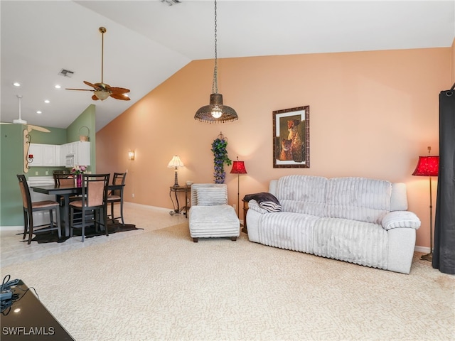 1170 Partridge Ln Unit 202, Naples, FL 34104 - living area with lofted ceiling, a ceiling fan, and light colored carpet