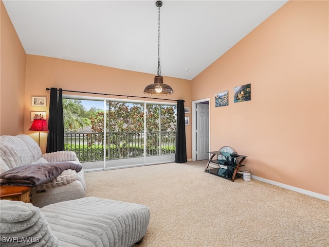 1170 Partridge Ln Unit 202, Naples, FL 34104 - living room featuring carpet flooring and high vaulted ceiling