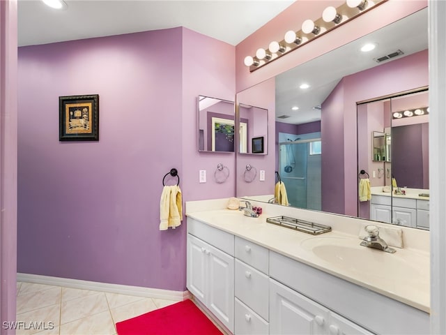 1170 Partridge Ln Unit 202, Naples, FL 34104 - full bath with double vanity, a stall shower, and tile patterned floors