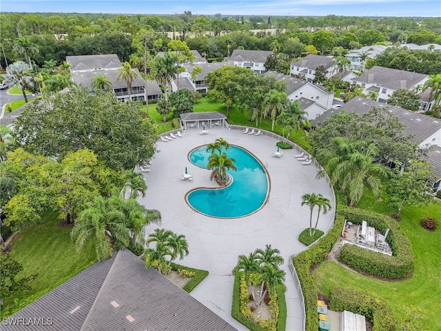 1170 Partridge Ln Unit 202, Naples, FL 34104 - aerial perspective of suburban area featuring a pool area and a tree filled landscape