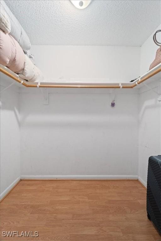 17236 Lee Rd, Fort Myers, FL 33967 - walk in closet featuring wood finished floors