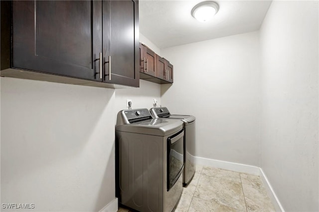 718 Coral Dr, Cape Coral, FL 33904 - laundry area featuring independent washer and dryer and cabinet space