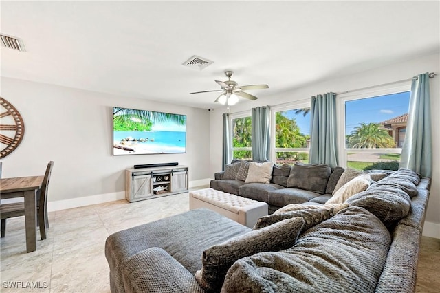 718 Coral Dr, Cape Coral, FL 33904 - living room featuring ceiling fan and baseboards