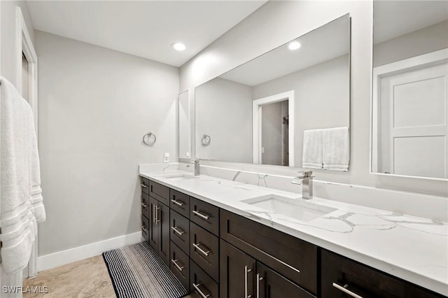 718 Coral Dr, Cape Coral, FL 33904 - bathroom featuring double vanity and recessed lighting