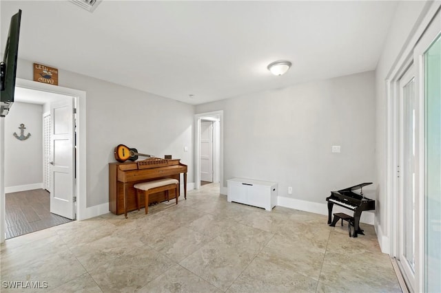 718 Coral Dr, Cape Coral, FL 33904 - sitting room with baseboards