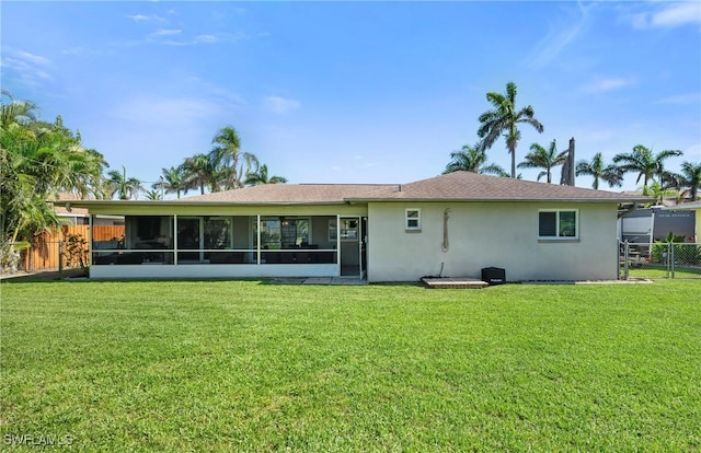 718 Coral Dr, Cape Coral, FL 33904 - back of house featuring stucco siding and a sunroom