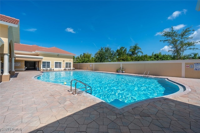 9035 Colby Dr Unit 2322, Fort Myers, FL 33919 - community pool featuring a patio