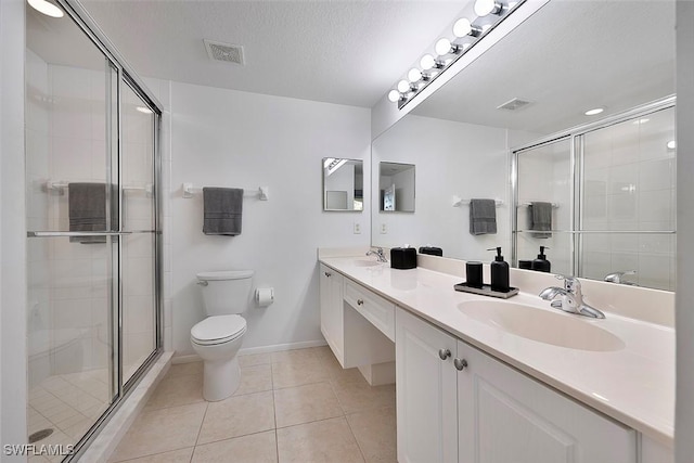 9035 Colby Dr Unit 2322, Fort Myers, FL 33919 - full bath with double vanity, a shower stall, tile patterned flooring, and a textured ceiling
