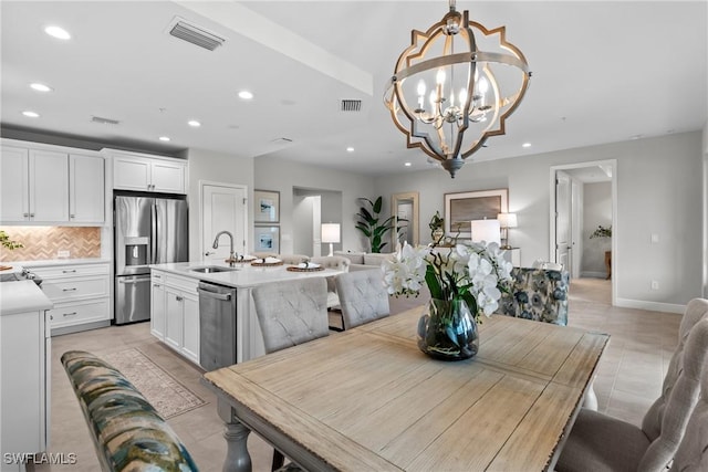 2609 Seychelles Cir Unit 1603, Naples, FL 34112 - dining space with recessed lighting, a chandelier, and light tile patterned floors