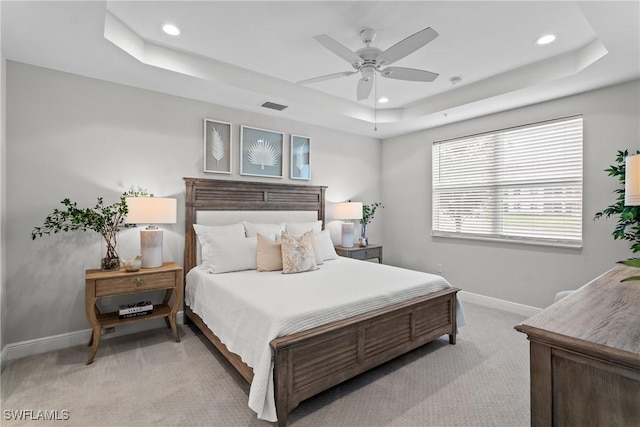 2609 Seychelles Cir Unit 1603, Naples, FL 34112 - bedroom with a tray ceiling, light colored carpet, recessed lighting, and ceiling fan