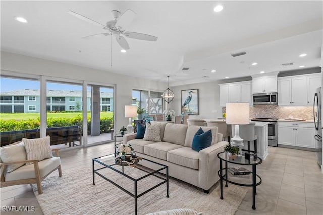 2609 Seychelles Cir Unit 1603, Naples, FL 34112 - living area featuring recessed lighting, a ceiling fan, and light tile patterned floors