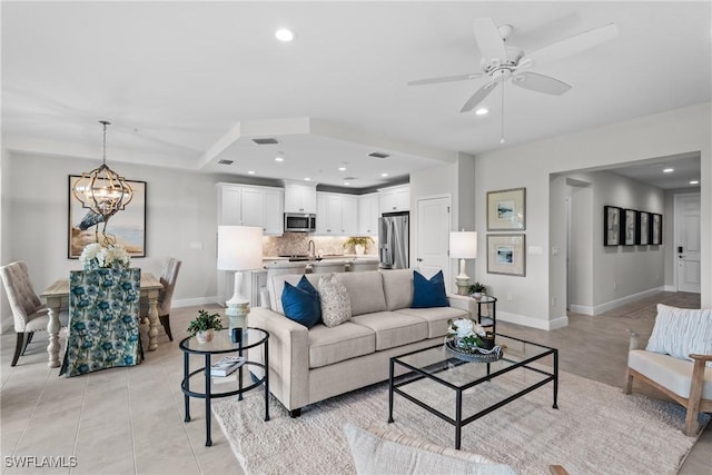 2609 Seychelles Cir Unit 1603, Naples, FL 34112 - living room with ceiling fan, recessed lighting, a chandelier, and light tile patterned floors