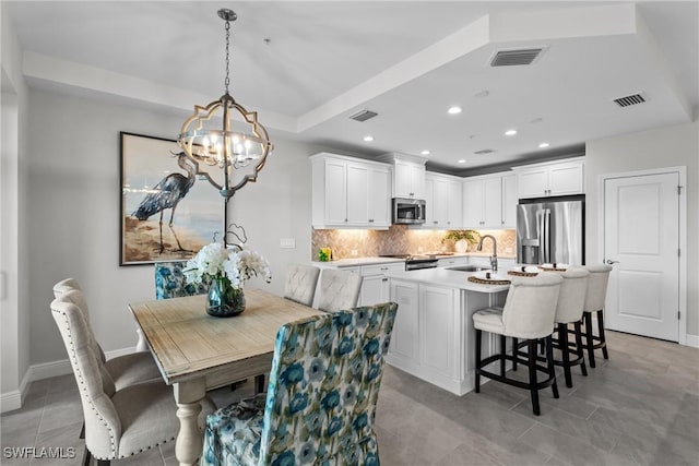 2609 Seychelles Cir Unit 1603, Naples, FL 34112 - dining room with a chandelier, light tile patterned flooring, and recessed lighting
