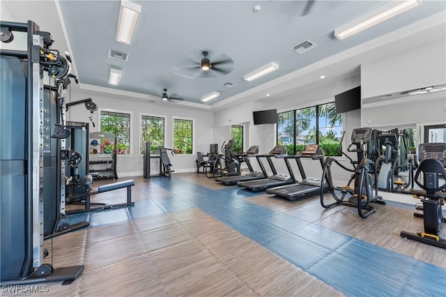 2609 Seychelles Cir Unit 1603, Naples, FL 34112 - workout area with a ceiling fan and a tray ceiling
