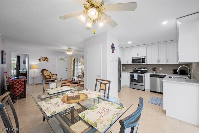 7400 College Pkwy Unit 59C, Fort Myers, FL 33907 - dining area featuring ceiling fan, light tile patterned floors, and recessed lighting
