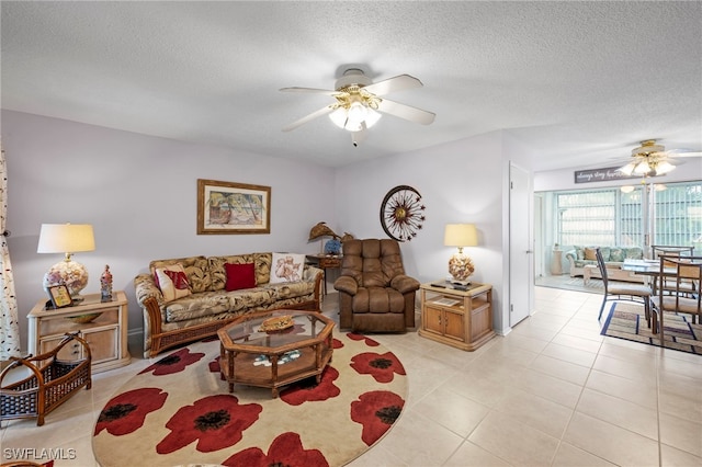 7400 College Pkwy Unit 59C, Fort Myers, FL 33907 - living area with ceiling fan, a textured ceiling, and light tile patterned floors