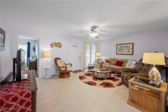 7400 College Pkwy Unit 59C, Fort Myers, FL 33907 - living room featuring a ceiling fan and a textured ceiling