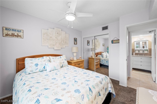 7400 College Pkwy Unit 59C, Fort Myers, FL 33907 - bedroom featuring a closet, carpet, and ceiling fan