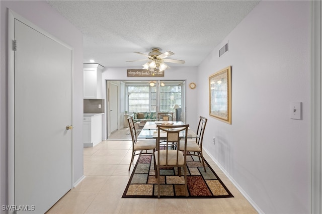 7400 College Pkwy Unit 59C, Fort Myers, FL 33907 - dining space featuring a ceiling fan, light tile patterned flooring, and a textured ceiling