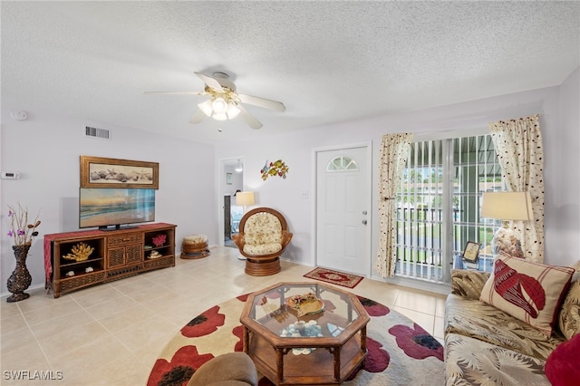 7400 College Pkwy Unit 59C, Fort Myers, FL 33907 - living area with a textured ceiling, a ceiling fan, and tile patterned floors