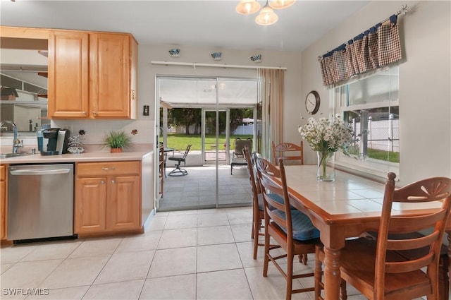 4180 Coconut Cir S, Naples, FL 34104 - kitchen featuring dishwasher, light countertops, light tile patterned floors, and light brown cabinetry