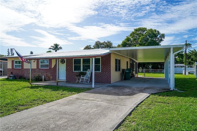 4180 Coconut Cir S, Naples, FL 34104 - view of front of home with an attached carport, concrete driveway, covered porch, and brick siding