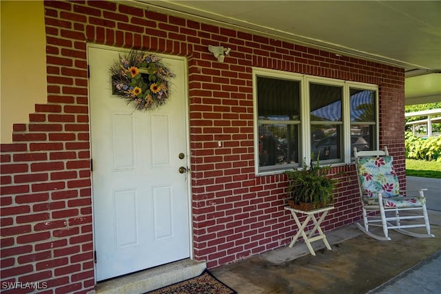 4180 Coconut Cir S, Naples, FL 34104 - property entrance with brick siding and covered porch