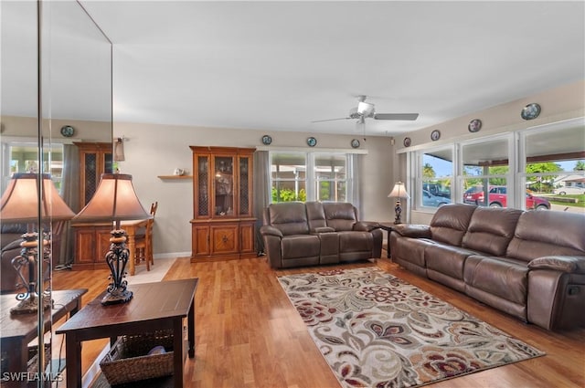 4180 Coconut Cir S, Naples, FL 34104 - living area with a ceiling fan and light wood-style floors
