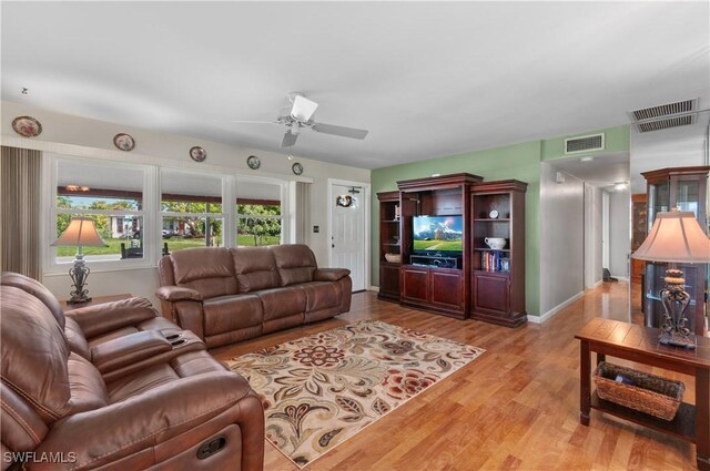 4180 Coconut Cir S, Naples, FL 34104 - living room featuring ceiling fan and wood finished floors