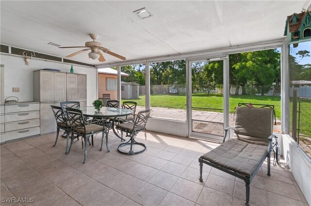 4180 Coconut Cir S, Naples, FL 34104 - sunroom / solarium with ceiling fan, plenty of natural light, and outdoor dining area